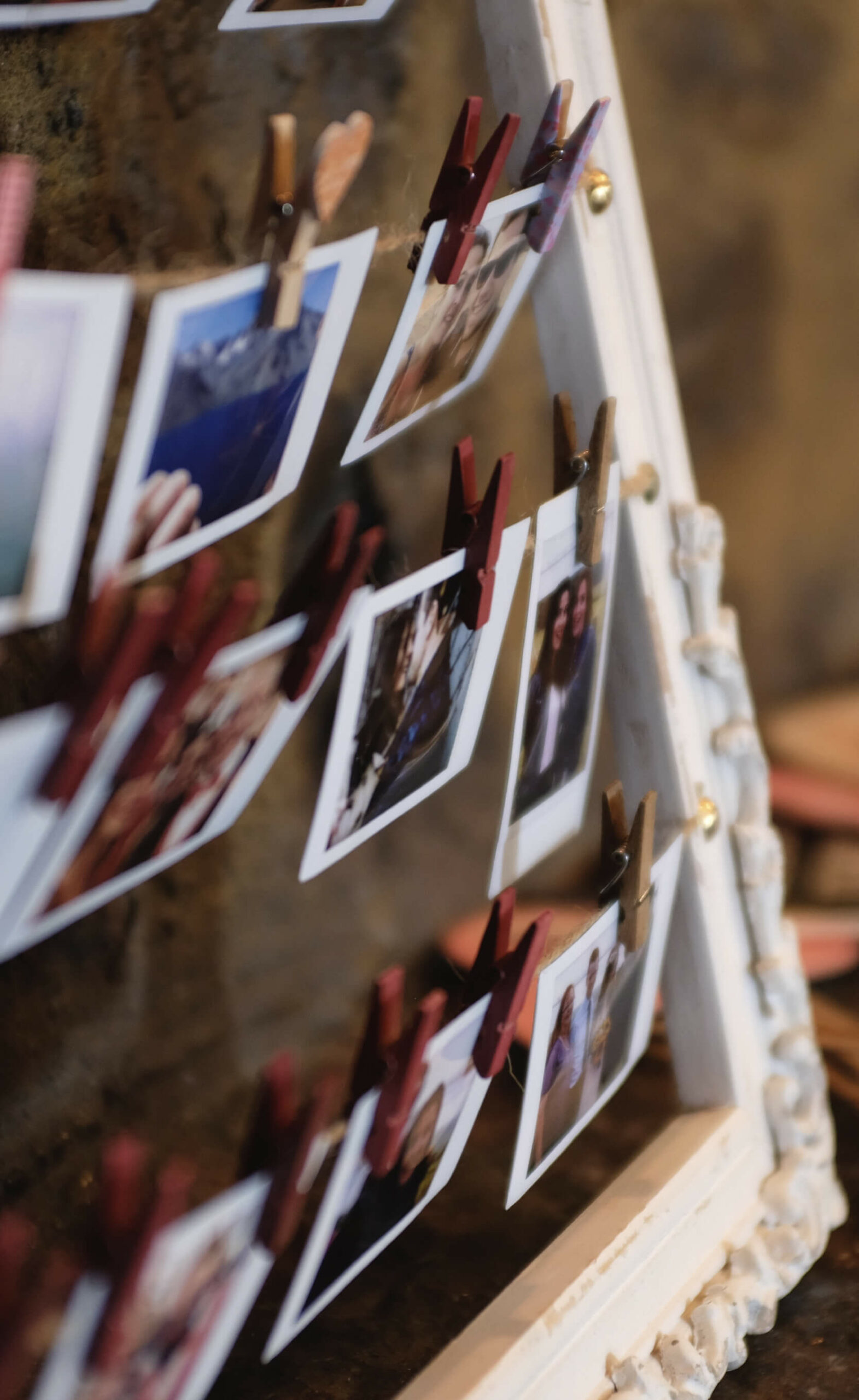 image of several photographs hanging up with clips